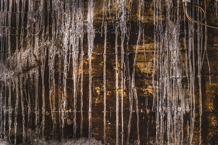 rusty surface with limescale or paint residue from running waterの写真素材