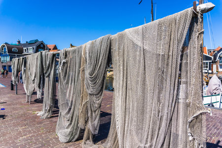 Fishing nets hanging in the sun to dryの写真素材