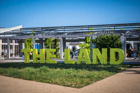 Mannheim, Germany - May 26, 2023: Word The Laend in big green letters (German-English mixture for: the country) at the Bundesgartenschau (federal horticulture show)のeditorial素材