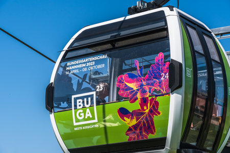 Mannheim, Germany - May 26th, 2023: Cabin of the cable car which connects the Luisenpark with the Spinelli Park during the Bundesgartenschau (federal horticulture show).のeditorial素材