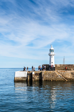 Mevagissey, Cornwall, UK - August 16, 2023: The lighthouse at Mevagissey on the south coast of Cornwallのeditorial素材