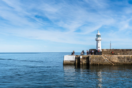 Mevagissey, Cornwall, UK - August 16, 2023: The lighthouse at Mevagissey on the south coast of Cornwallのeditorial素材