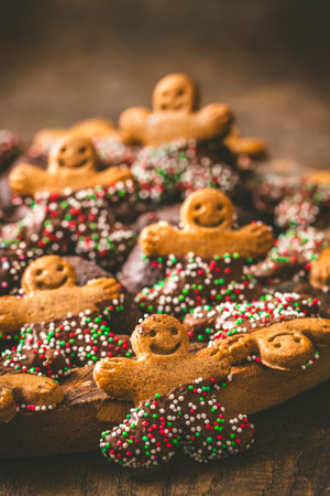 Sweet Christmas cookies, gingerbread, on a dark wooden tableの写真素材