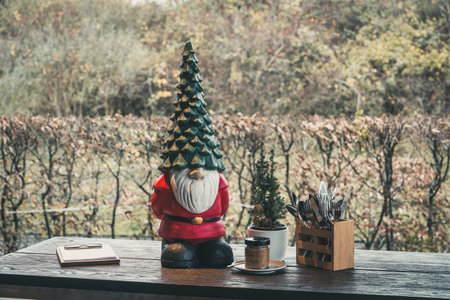 Christmas decoration on a wooden table of a cafe with view to natureの写真素材