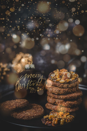 Cookies, gingerbread and Christmas decoration, black and gold, verticalの写真素材