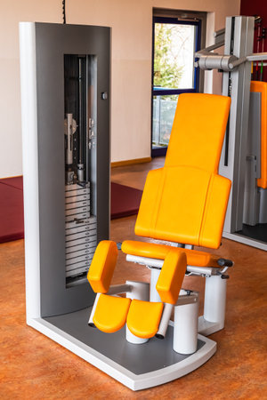 Abduction machine for strength training for legs in weight room, bodybuilding concept, verticalの写真素材