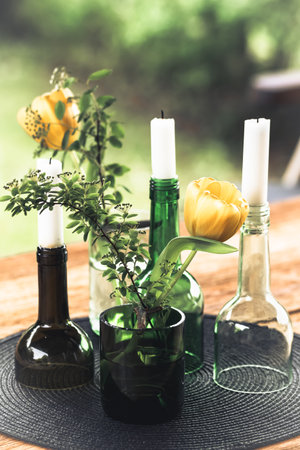 Candlesticks and vases, decoration made from green wine bottles, craft tip, verticalの写真素材