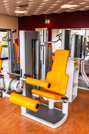 Fitness machine for strength training for legs in weight room, bodybuilding concept, verticalの写真素材