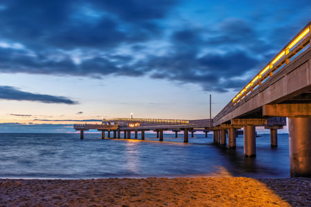 Pier of German city Heiligenhafen at the Baltic Sea at blue hour