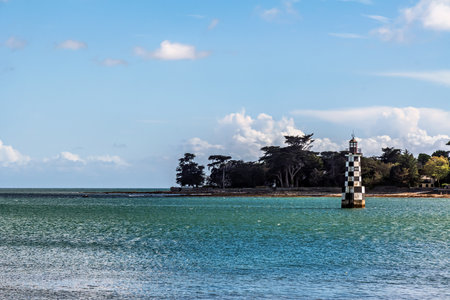 Black and white lighthouse of Ile Tudy in Brittany in France in summerの写真素材