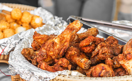 Plate with fried chicken wings at a street food stall, Asian street foodの写真素材