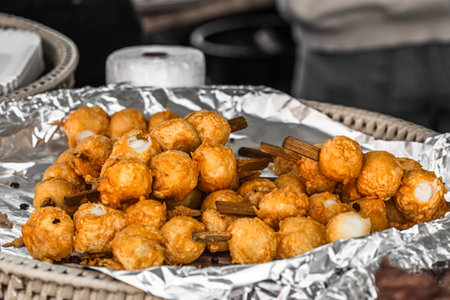 Skewers with Thai fried fish balls at food street marketの写真素材