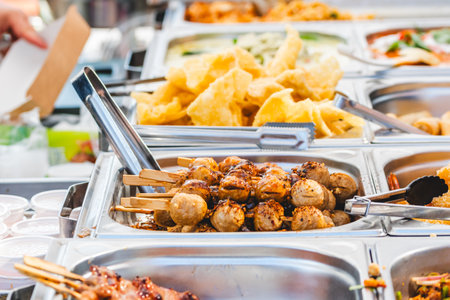 Skewers of Thai meatballs at a food stand, Thai street foodの写真素材