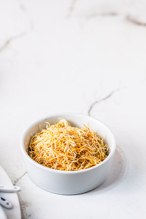 Butter roasted Kadayif pastry, fine dough threads for delicious sweet desserts, Turkish cuisine
