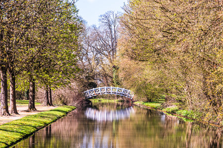 White bridge in the castle park of Schwetzingen, Germany, on a sunny spring morningの写真素材
