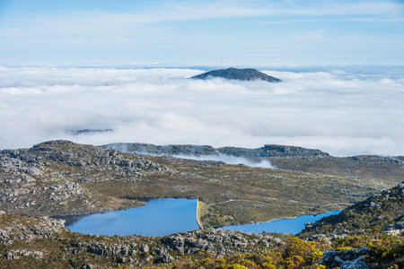 Landscape on the top of Table Mountain, Cape Town, South Africa, surrounded by cloudsの写真素材