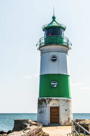 The Lighthouse of Schimmeluende at Western coast of Baltic Sea in Northern Germany marks the entrance from the sea into the Schlei. Copyspace.の写真素材