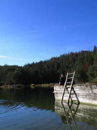sitting on a lake in autumnの写真素材