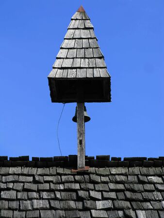 tower with bell on top of the roofの写真素材