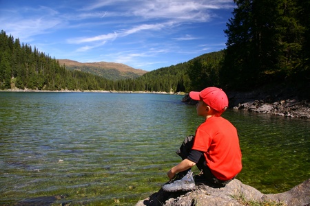 boy on lakeの写真素材