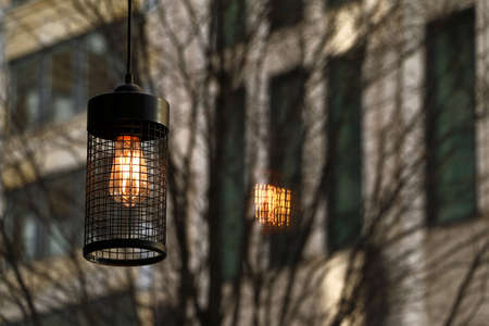 Lighting lantern in a cafe and its reflectionの写真素材