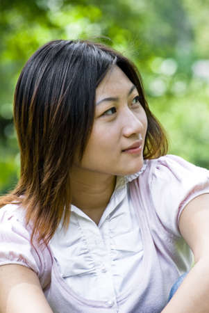 Lovely Asian girl in the park.の写真素材