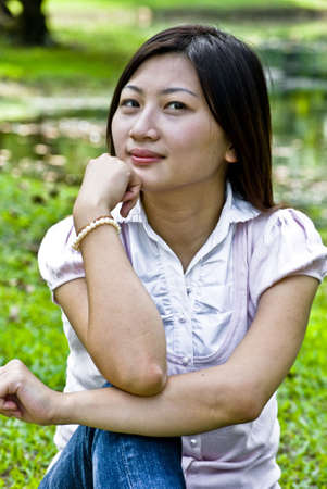 Lovely Asian girl in the park.の写真素材