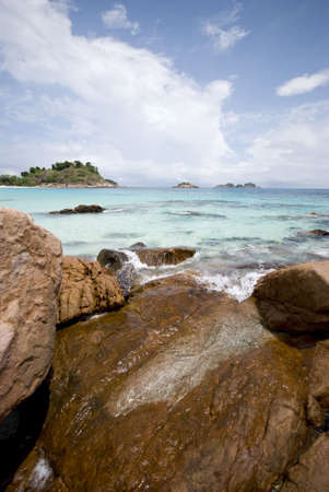 View of sea and island from the beach.