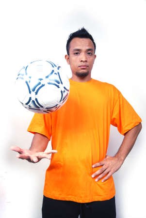 A male football player. Portrait studio shot.の写真素材
