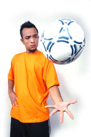 A male football player. Portrait studio shot.の写真素材