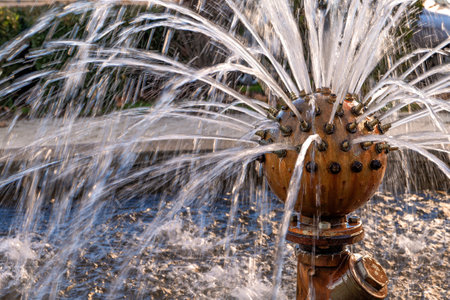 Spherical water fountain with many jets in a public park in Zamora, Spain. Life and relaxation concept.の写真素材
