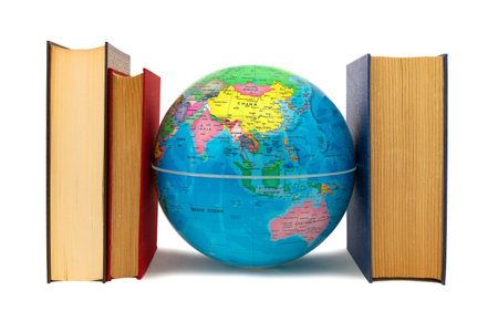 Earth globe escorted by books where you can see Asia and Australia: protection and defense concept. Books, a source of knowledge, flank the Earth as defense, protection and care.の写真素材