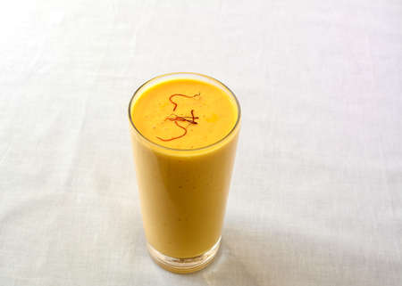 Lassi is a sweet Indian drink, consisting of beaten yogurt. This is a mango flavoured lassi.の写真素材