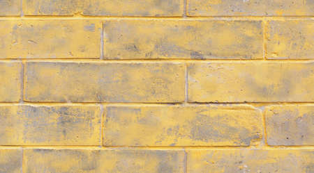 Seamless light yellow brick wall texture background