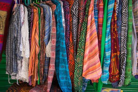 Bright oriental coloured cloth fabric background from Nepal and Indiaの写真素材