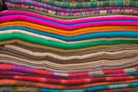 Bright oriental coloured cloth fabric background from Nepal and Indiaの写真素材