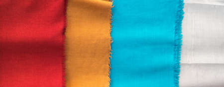 Bright oriental coloured cloth fabric background from Nepal and Indiaの写真素材