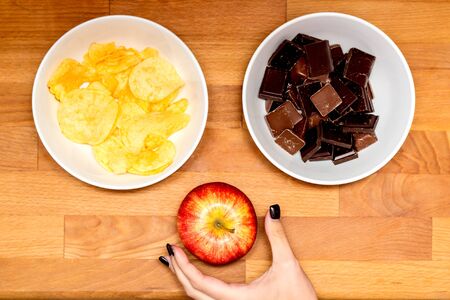 Hand reaching for appleの写真素材