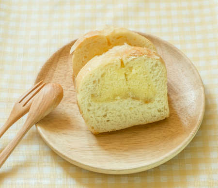 Butter bread sliced on wooden dish
