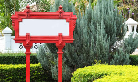 red sign board and tree backgroundの写真素材