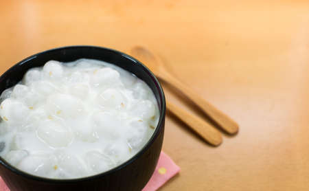 Thai dessert. Caramelized crisps in coconut cream with clipping path.の写真素材