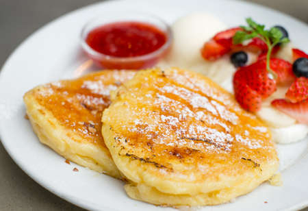 traditional pancakes with strawberries and vanilla ice cream, selective focus pancakeの写真素材