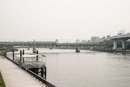 The train across a river in japan, sepia tone effect