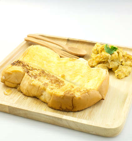 honey toast with omlette on wood dishの写真素材