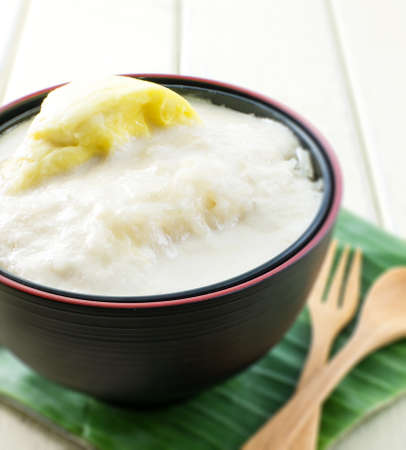 Durian sticky rice on black bowl and banana leaf