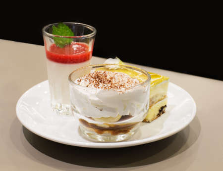 banoffee with strawberry moose and vanilla cakeの写真素材