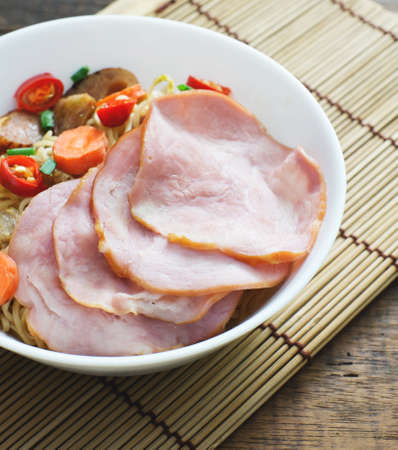 chinese noodle with ham and vegetablesの写真素材