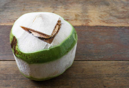 raw coconut on wood backgroundの写真素材