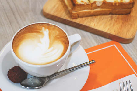 hot  espresso coffee  and bread, soft focusの写真素材