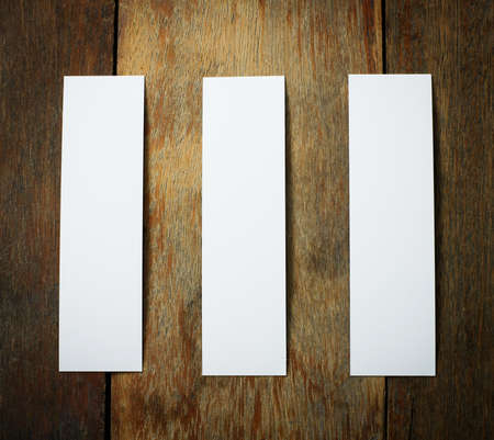 three white tag paper on rustic wood